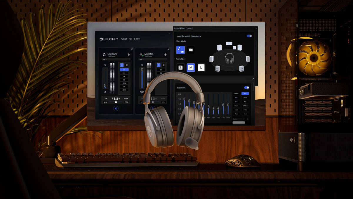 Floating ENDORFY Viro Wireless Alt Gray headphones. In the background, there is a computer setup and a monitor running the dedicated ENDORFY Viro Studio software