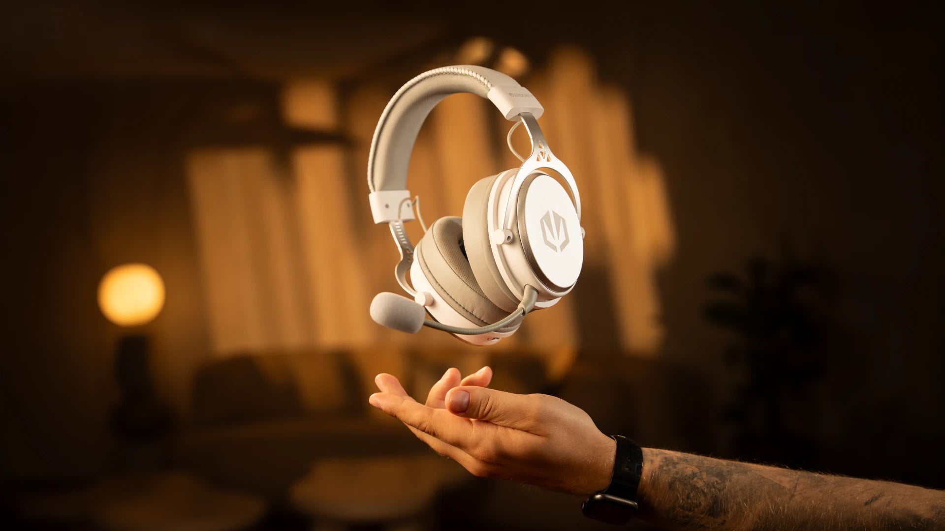ENDORFY Viro Wireless Onyx White headphones floating above a model’s hand