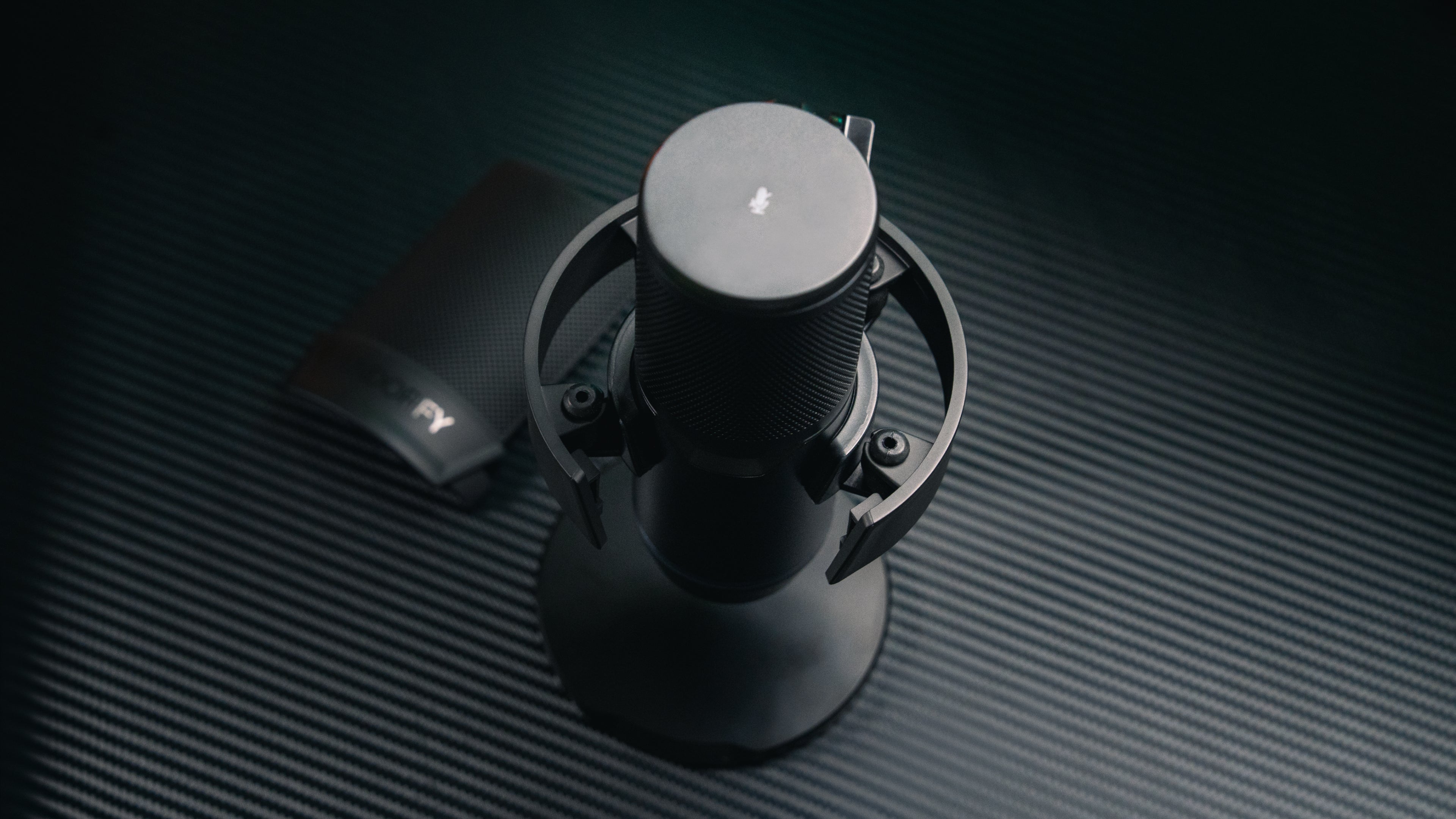 Close-up of the open shock mount holding the Solum 2 microphone