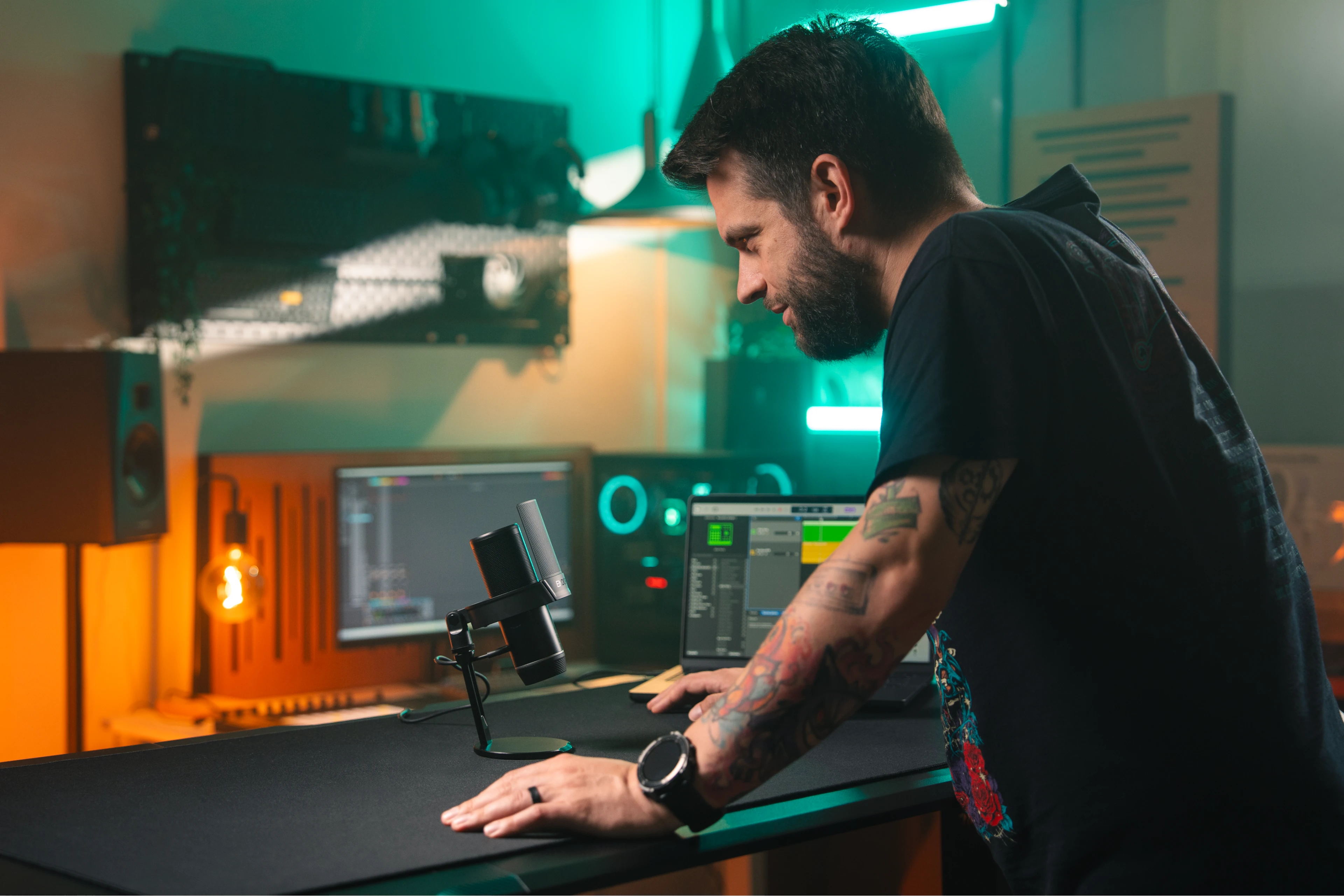 Model speaking into the Solum 2 Pro microphone set up on a desk