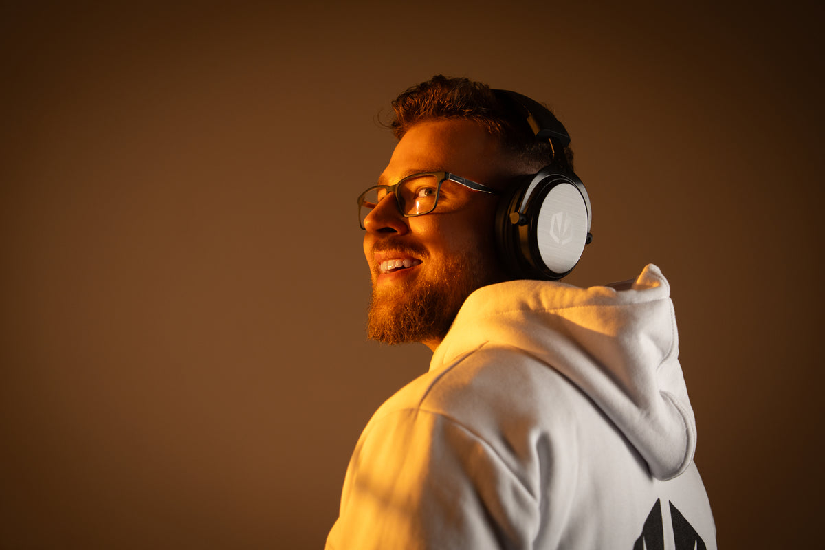 ENDORFY Viro Wireless worn by a smiling man in a white hoodie, shown from the side and back